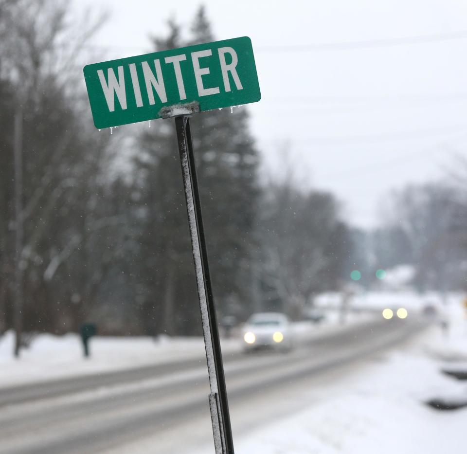 Drivers navigate state Route 44 in Nimishillen Township as a winter storm moved through the region in this file photo.