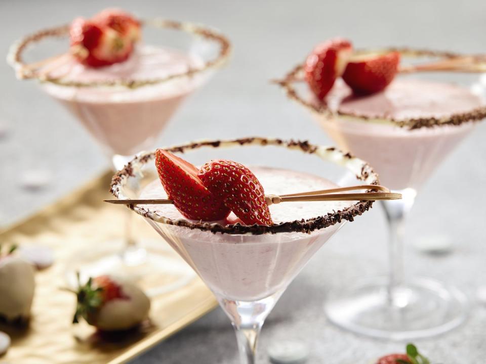 Vanilla martini served with strawberries in a white chocolate dipped cocktail glass (Aldi)