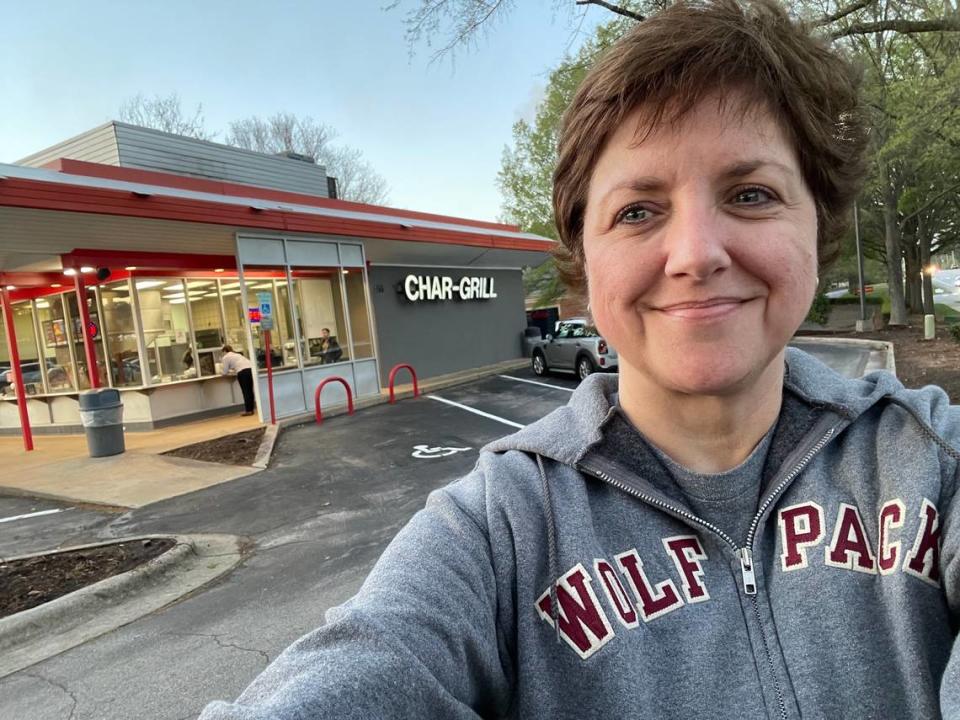 Superstitious NC State grad Brooke Cain in her lucky Wolfpack hoodie in front of Char Grill on Edwards Mill Road in Raleigh, where she orders her lucky game day meal when State’s basketball team plays in the NCAA tournament this year. Brooke Cain/bcain@newsobserver.com