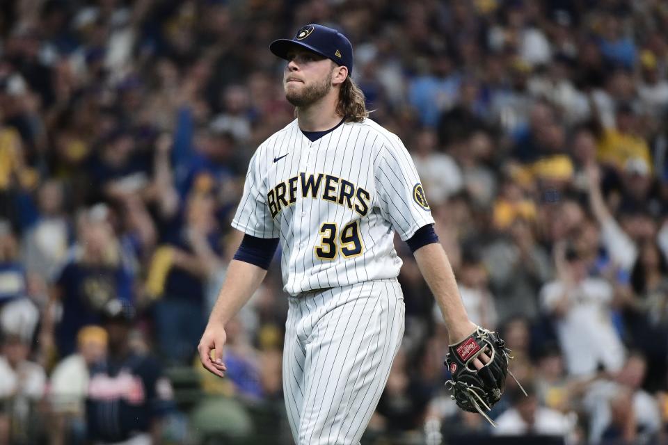 Oct 8, 2021; Milwaukee, Wisconsin, USA; Milwaukee Brewers starting pitcher Corbin Burnes (39) walks back to the dugout in an inning break in the sixth inning against the Atlanta Braves during game one of the 2021 NLDS at American Family Field.  Mandatory Credit: Benny Sieu-USA TODAY Sports