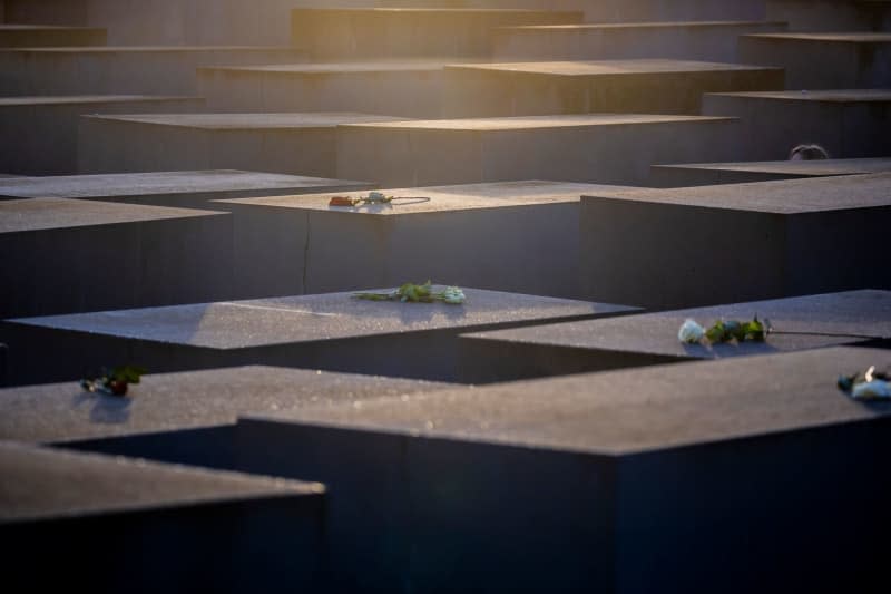 Roses lie on stelae at the Memorial to the Murdered Jews of Europe to mark the International Day of Commemoration in Memory of the Victims of the Holocaust. Christoph Soeder/dpa