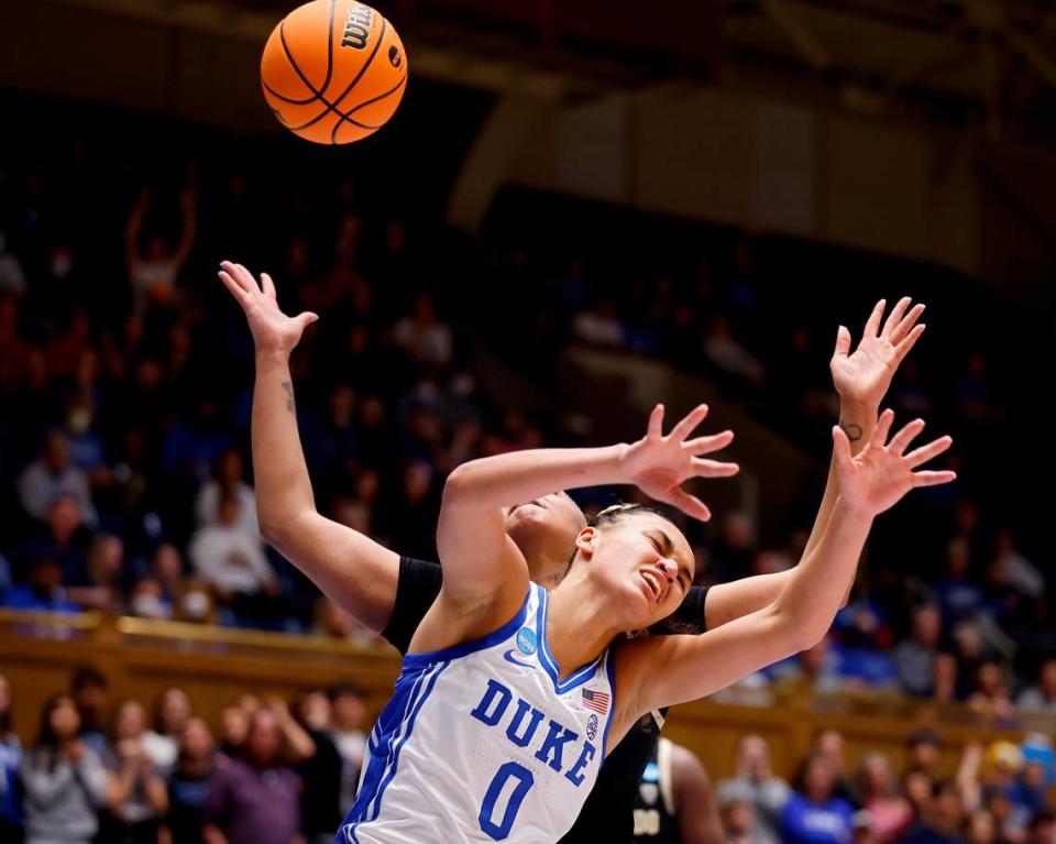 Duke’s Celeste Taylor and Colorado’s Quay Miller battle for possession during the first half of an NCAA Tournament second round game at Cameron Indoor Stadium on Monday, March 20, 2023, in Durham, N.C.