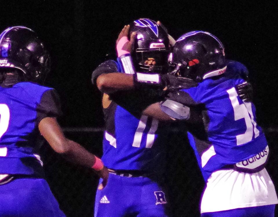 #11 Nathanyel Gomes Correia gets congrats from teammates after scoring a long TD with the first play from scrimmage in the 2nd half against Carver. According to head coach Jonathan Marshall, this is the 3rd time in 5 games Corriea has done that. Game on Thursday, Oct. 12, 2023.