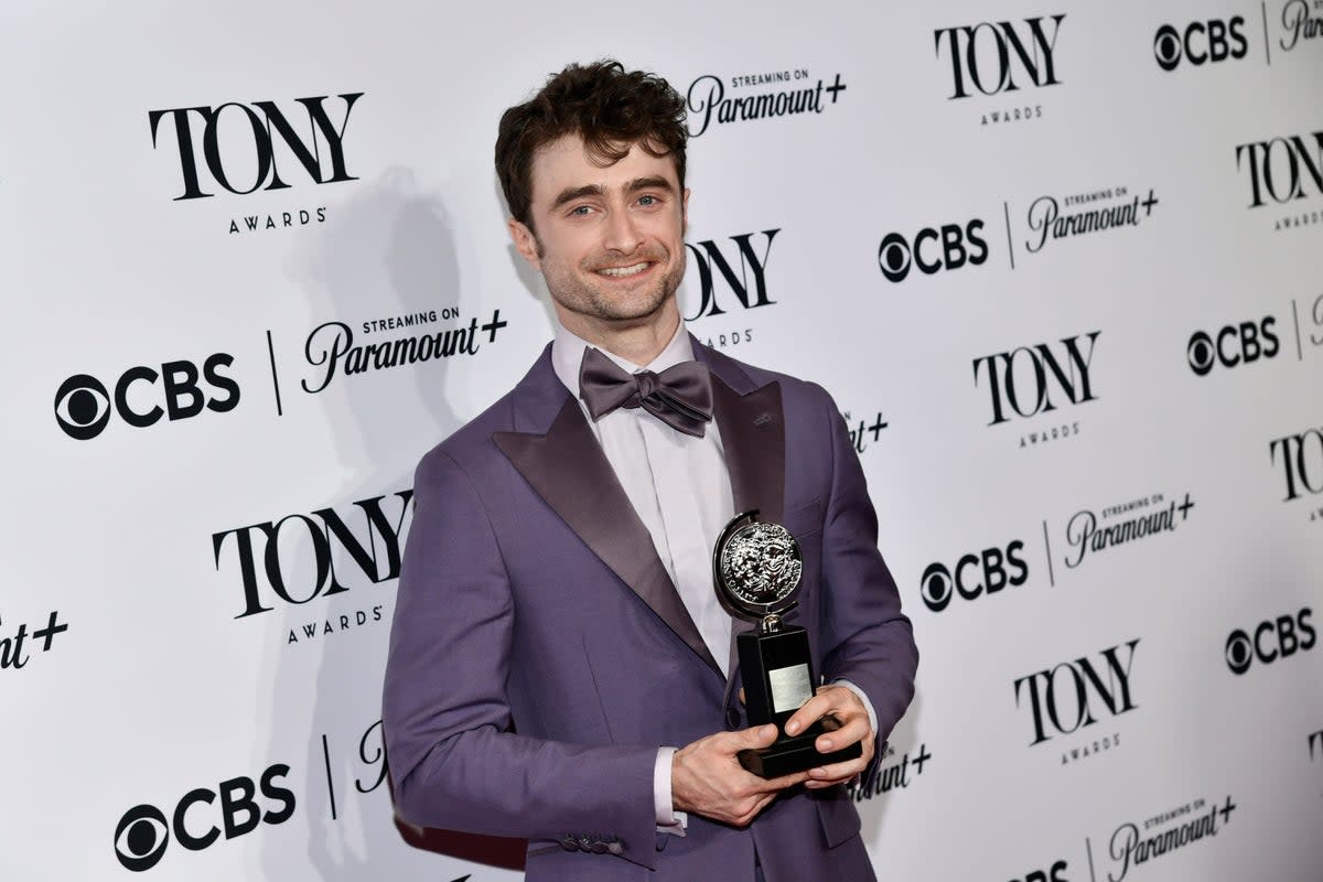Daniel Radcliffe poses in the press room with the award for best performance by an actor in a featured role in a musical for Merrily We Roll Along (Evan Agostini/Invision/AP) (AP)