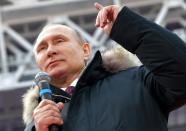 <p>Russian President Vladimir Putin gestures while speaking during a massive rally in his support as a presidential candidate at the Luzhniki stadium in Moscow, Russia, Saturday, March 3, 2018. (Photo: Alexei Druzhinin, Sputnik/Kremlin Pool Photo via AP) </p>