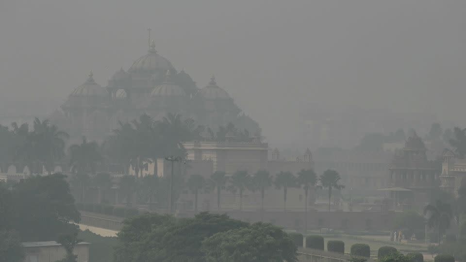 The Akshardham temple is seen amid heavy smog conditions in New Delhi on November 9, 2023. - Arun Sankar/AFP/Getty Images