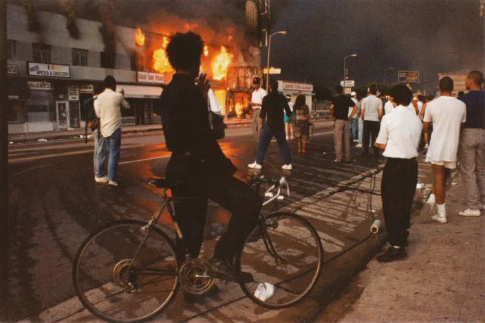 Burning retail stores on Pico Boulevard during the Rodney King riots, April 30, 1992 in Los Angeles