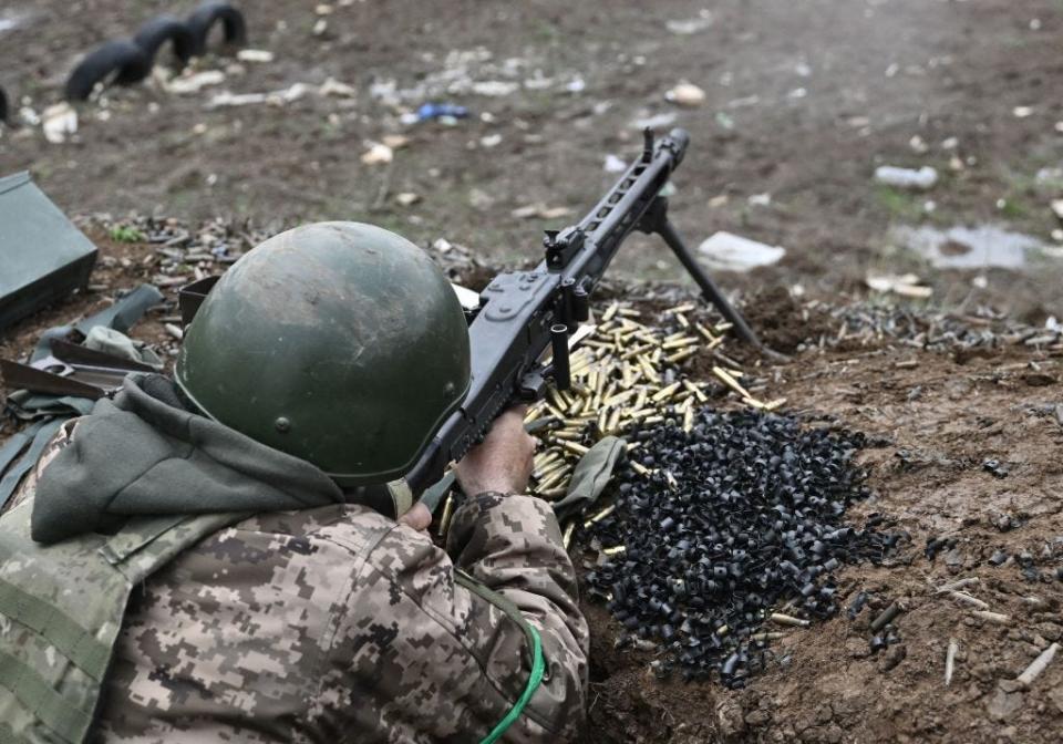 A Ukrainian serviceman aims with a machine gun as he attends a training exercise in the Donetsk region on April 7, 2023, amid the Russian invasion of Ukraine.