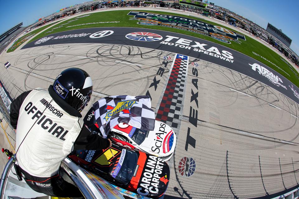 Sam Mayer, driver of the #1 Carolina Carports Chevrolet, crosses the finish line ahead of Ryan Sieg, driver of the #39 Sci Aps Ford, to win the NASCAR Xfinity Series Andy's Frozen Custard 300 at Texas Motor Speedway on April 13, 2024 in Fort Worth, Texas. (Photo by Jonathan Bachman/Getty Images)