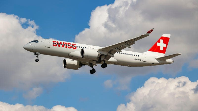 Swiss Airbus A220-300 aircraft or former Bombardier CS300 BD-500 model, as seen on final approach flying for landing at the runway of London Heathrow International Airport LHR.