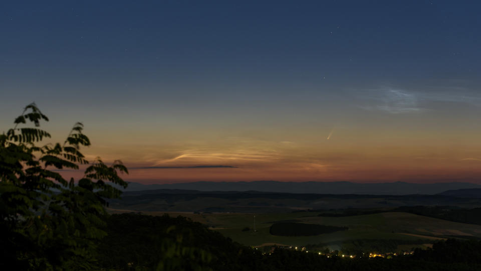 The Comet NEOWISE or C/2020 F3 is seen above Cered, Hungary, Monday, July 6, 2020. It passed closest to the Sun on 03 July and its closest approach to Earth will occur on 23 July. (Peter Komka/MTI via AP)