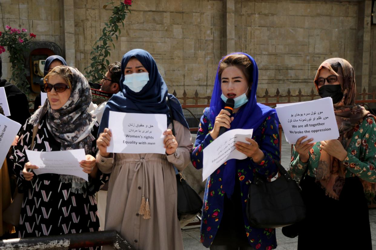 Women gather to demand their rights under the Taliban rule during a protest in Kabul, Afghanistan, Friday, Sept. 3. 