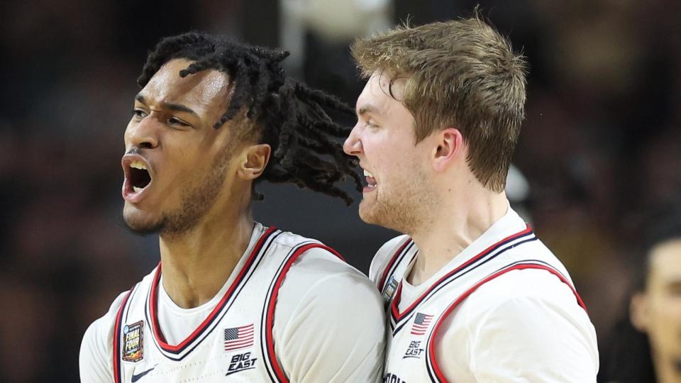 Stephon Castle #5 and Cam Spencer #12 of the Connecticut Huskies celebrate in the second half against the Purdue Boilermakers during the NCAA Men's Basketball National Championship game on April 08, 2024, (Photo by Jamie Squire/Getty Images) (Jamie Squire/Getty Images)