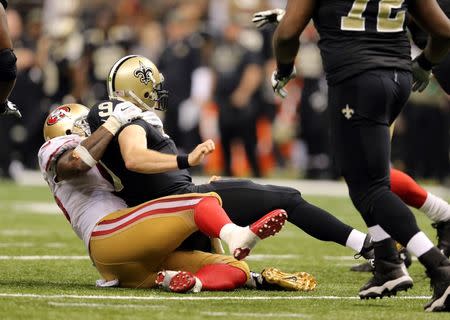 Nov 9, 2014; New Orleans, LA, USA; San Francisco 49ers outside linebacker Ahmad Brooks (55) sacks New Orleans Saints quarterback Drew Brees (9) in overtime at Mercedes-Benz Superdome. The 49ers won 27-24. Mandatory Credit: Chuck Cook-USA TODAY Sports