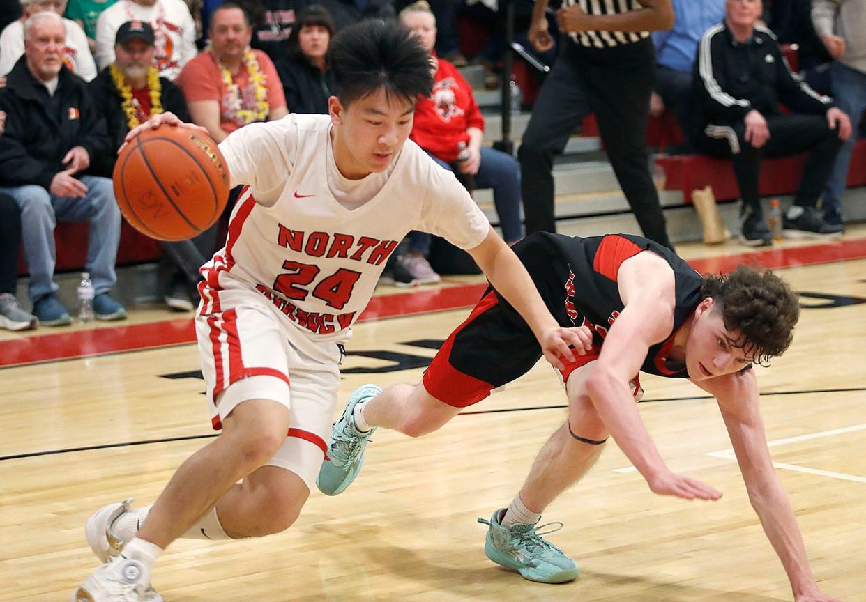 Raider Kobe Nguyen steals the ball from Drew Daley.North Quincy hosted Whitman-Hanson in MIAA tournament action narrowly beating W-H by one point on a free throw with less than a second to play on Friday March 3, 2023 