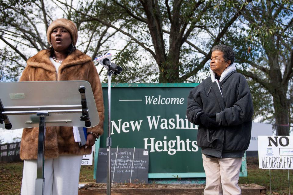 Angela Aiken, New Washington Heights community association spokesperson, left, and Charity Jones, community member, protest against the Greenlink bus hub that is being built on the site of the former Washington High School in the neighborhood on Monday, Nov. 14, 2022.
