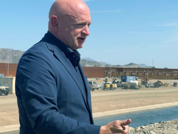 PHOTO: Sen. Mark Kelly, D-Ariz., speaks to reporters at the border wall in Yuma, Arizona, on Aug. 10, 2022, about immigration and the state's water crisis.  (Libbey Cathey/ABC News)