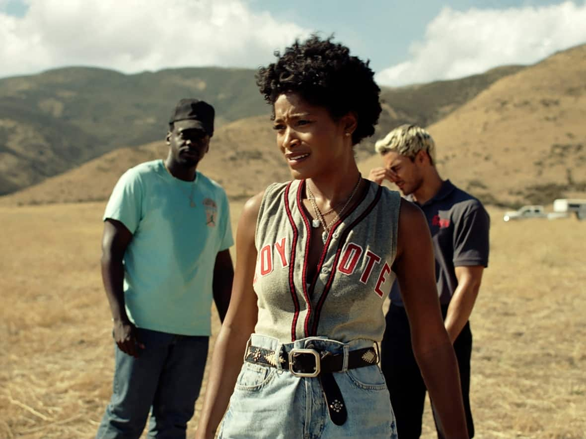 From left, Daniel Kaluuya, Keke Palmer, and Brandon Perea appear in a scene from Nope, a horror film directed by Jordan Peele released in theatres on Friday. (Universal Pictures via The Associated Press - image credit)