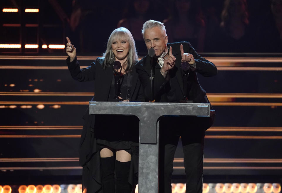 Inductees Pat Benatar, left, and Neil Giraldo speak during the Rock & Roll Hall of Fame Induction Ceremony on Saturday, Nov. 5, 2022, at the Microsoft Theater in Los Angeles. (AP Photo/Chris Pizzello)