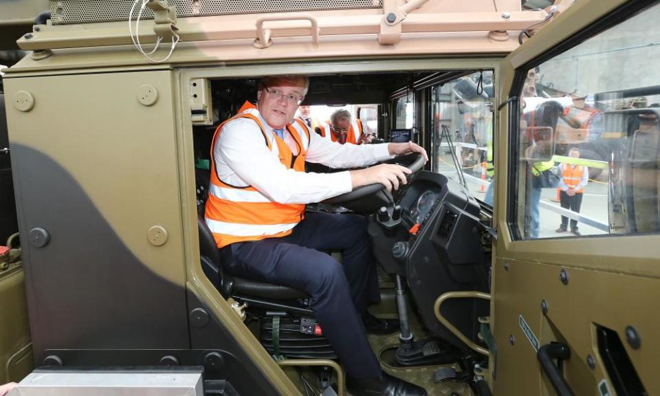 Going nowhere: Scott Morrison sits at the wheel of a a truck during a factory visit in Brisbane in August.