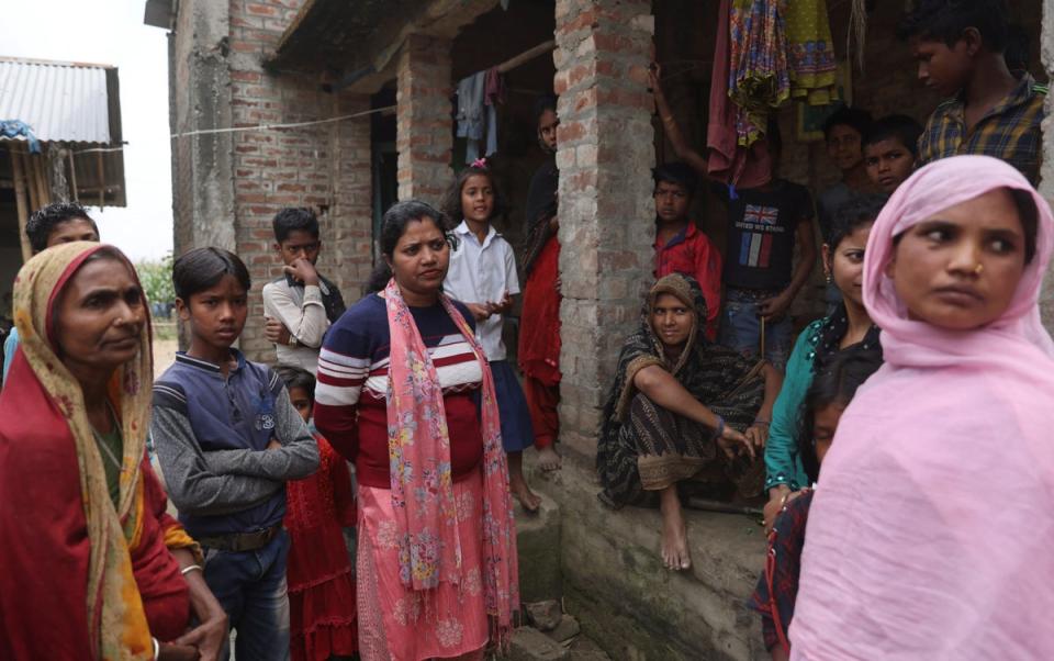 Community mobiliser Pratima Kumari outside a house in Duadangi village (Reuters)