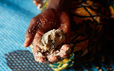 A handfull of couscous and baobab leaves - Credit: Yuki Sugiura/British Red Cross