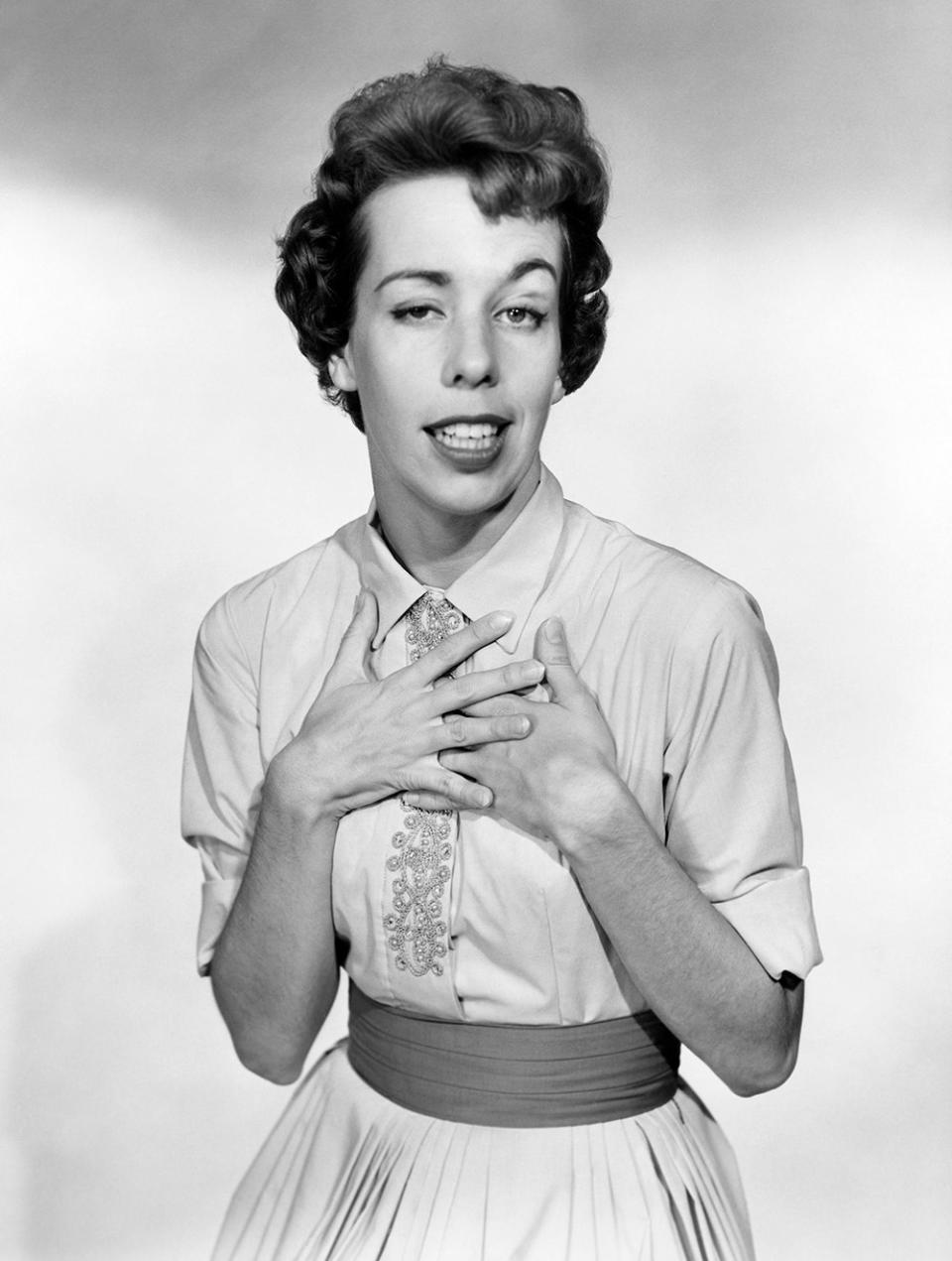 A black and white photo of Carol Burnett making a funny face