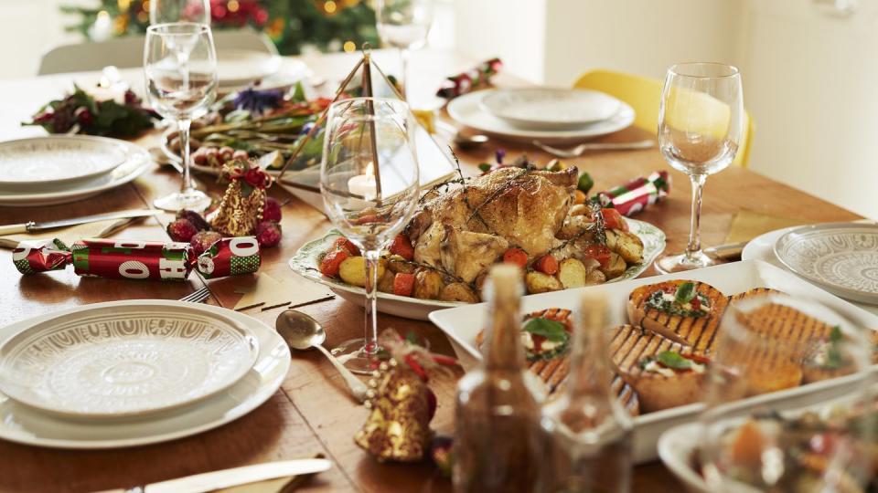 food with wine served on table during christmas