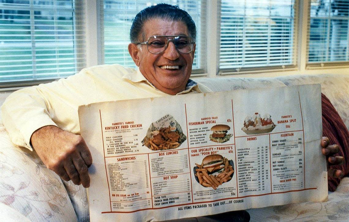 Joe Smiley holds an early Parkette menu on March 15, 1992. He opened the legendary when New Circle was a dirt road.