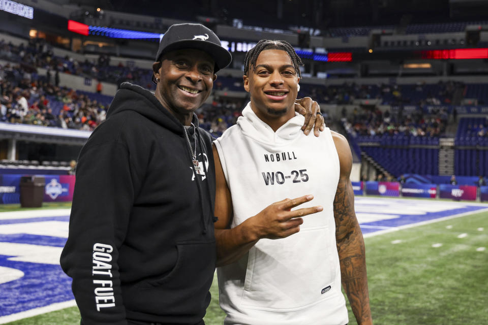 Jerry Rice poses for a picture with his son, Brenden Rice of Southern California, during the NFL scouting combine. (Photo by Kara Durrette/Getty Images)