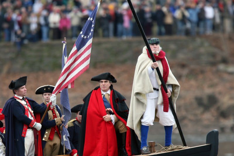 Robert Gerenser (C) portrays Gen. George Washington as he and other members of the Washington Crossing Re-enactors Society take part in the 54th annual re-enactment of the famous crossing of the Delaware River from Washington Crossing, Pennsylvania to Washington Crossing, New Jersey on December 25, 2006. On December 19, 1777, Washington and the Continental Army began a winter encampment at Valley Forge, Pa. File Photo by John Anderson/UPI