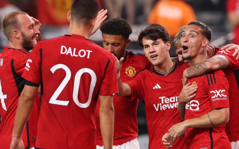 Antony (left) celebrates after making it 2-2 - Andre Onana confronts Harry Maguire as Erik ten Hag slams Man Utd for Borussia Dortmund capitulation