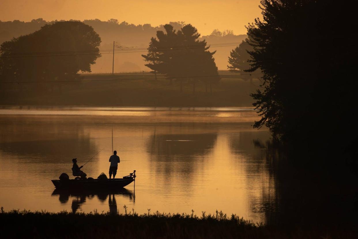 File photo: Fishermen fish off of a boat in Long Arm Reservoir.