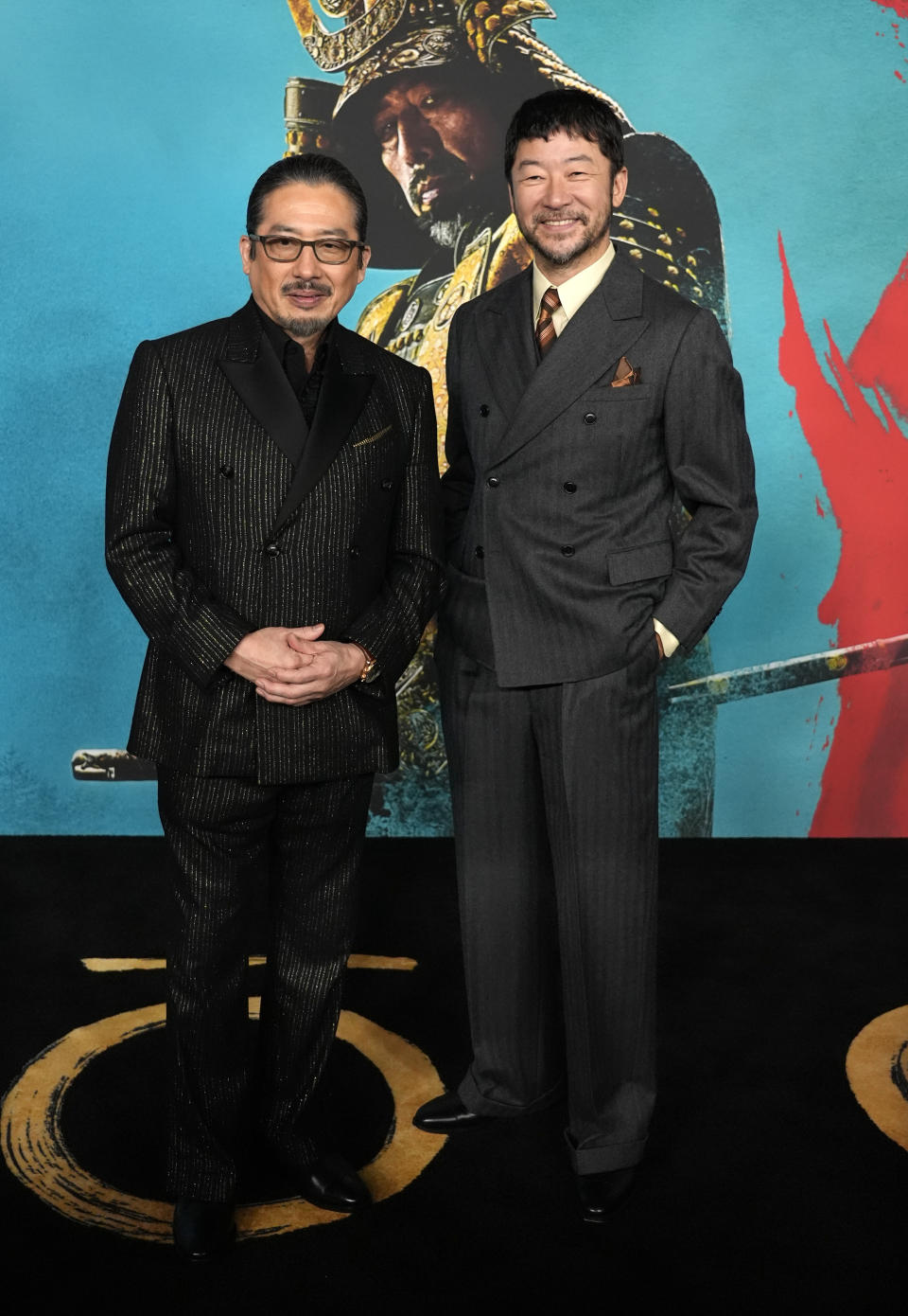 Hiroyuki Sanada, left, and Tadanobu Asano, cast members in "Shogun," pose together at the premiere of the FX limited series at The Academy Museum, Tuesday, Feb. 13, 2024, in Los Angeles. (AP Photo/Chris Pizzello)