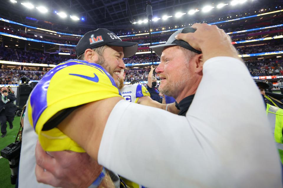 Rams quarterback Matthew Stafford celebrates with general manager Les Snead after defeating the Bengals in Super Bowl 56 on Sunday, Feb. 13, 2022, in Inglewood, California.