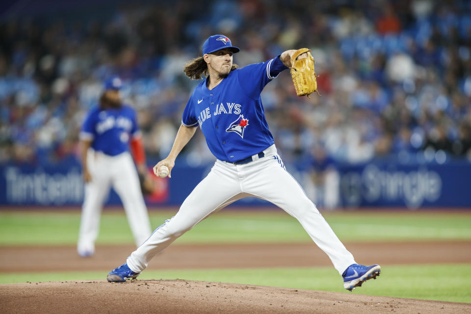 Toronto Blue Jays starting pitcher Kevin Gausman throws in the first inning of a baseball game against the Boston Red Sox in Toronto, Sunday, Oct. 2, 2022. (Cole Burston/The Canadian Press via AP)