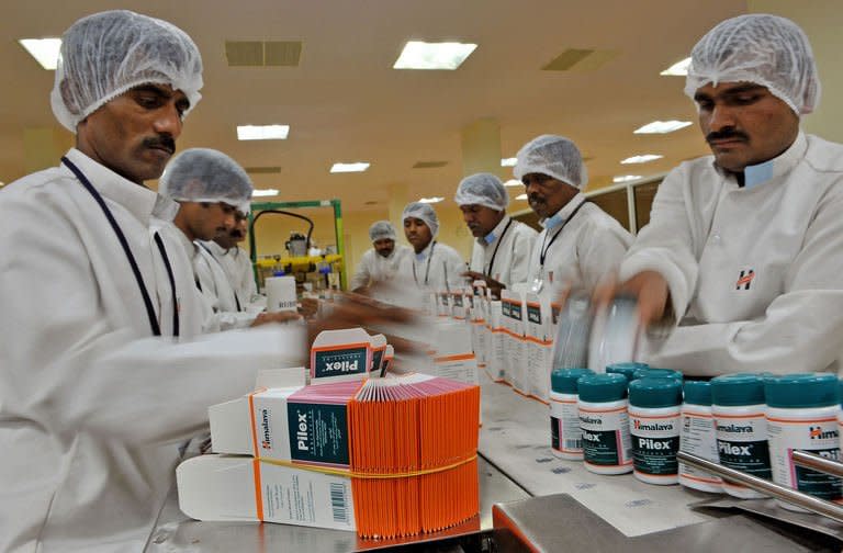 Workers at the secondary packing unit of Himalaya Drug Company are pictured in Bangalore, on February 14, 2013. Himalaya's raw materials are plants and it bases its products on texts dating back millenia and, it currently is India's biggest herbal healthcare group