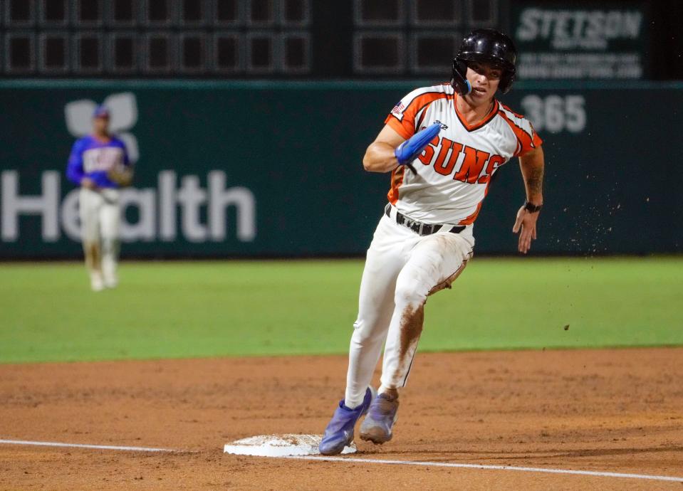 Suns' outfielder Joseph Becker rounds third against the Winter Garden Squeeze at Melching Field in DeLand, Wednesday, July 19, 2023. The Edgewater native came into the summer wanting to focus on his base-running.