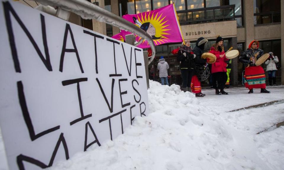 Campaigners in front of Winnipeg city hall during a rally