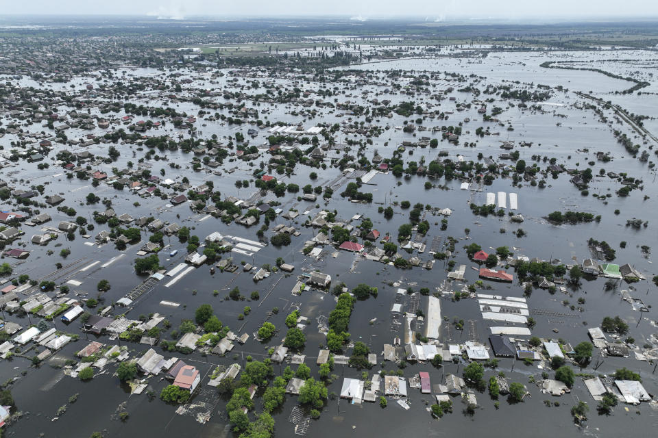 Houses are seen underwater in the flooded town of Oleshky, Ukraine, Saturday, June 10, 2023. The destruction of the Kakhovka Dam in southern Ukraine is swiftly evolving into long-term environmental catastrophe. It affects drinking water, food supplies and ecosystems reaching into the Black Sea. (AP Photo)