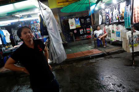 Street vendors sell clothes in Khaosan Road at Bangkok, Thailand, September 12, 2018. Picture taken September 12, 2018. REUTERS/Soe Zeya Tun