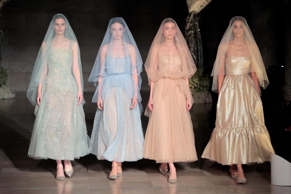 From over-the-top feathers to breezy caftans, these are the trends defining Fall 2019 bridal.