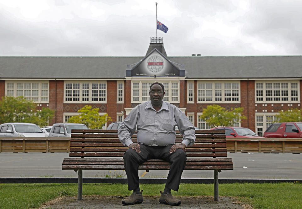 Ahmed Tani poses a portrait in front of Hagley College in Christchurch, New Zealand, Sunday, March 17, 2019. Tani settled in Christchurch after fleeing civil war in Somalia. The New Zealand city seemed a place of peace. It was more than just physically distant from the strife he had known. With its leafy streets, vibrant gardens and green public parks, the Garden City was even visually a world away from his war-scorched past. But that peace hasn't always lasted and now the city will need to use its experience rebuilding from a 2011 earthquake to recover from the nation's worst terrorist attack.(AP Photo/Vincent Yu)