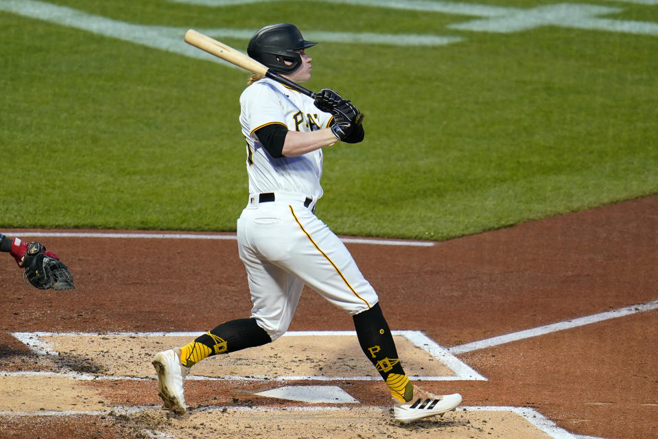 Pittsburgh Pirates' Jack Suwinski follows through on a solo home run off Chicago Cubs starting pitcher Javier Assad during the second inning of a baseball game in Pittsburgh, Friday, Sept. 23, 2022. (AP Photo/Gene J. Puskar)