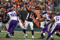 Dec 22, 2013; Cincinnati, OH, USA; Cincinnati Bengals quarterback Andy Dalton (14) passes the ball in the game against the Minnesota Vikings in the first quarter against the Minnesota Vikings at Paul Brown Stadium. Cincinnati Bengals beat the Minnesota Vikings by the score of 42-14. Mandatory Credit: Trevor Ruszkowksi-USA TODAY Sports