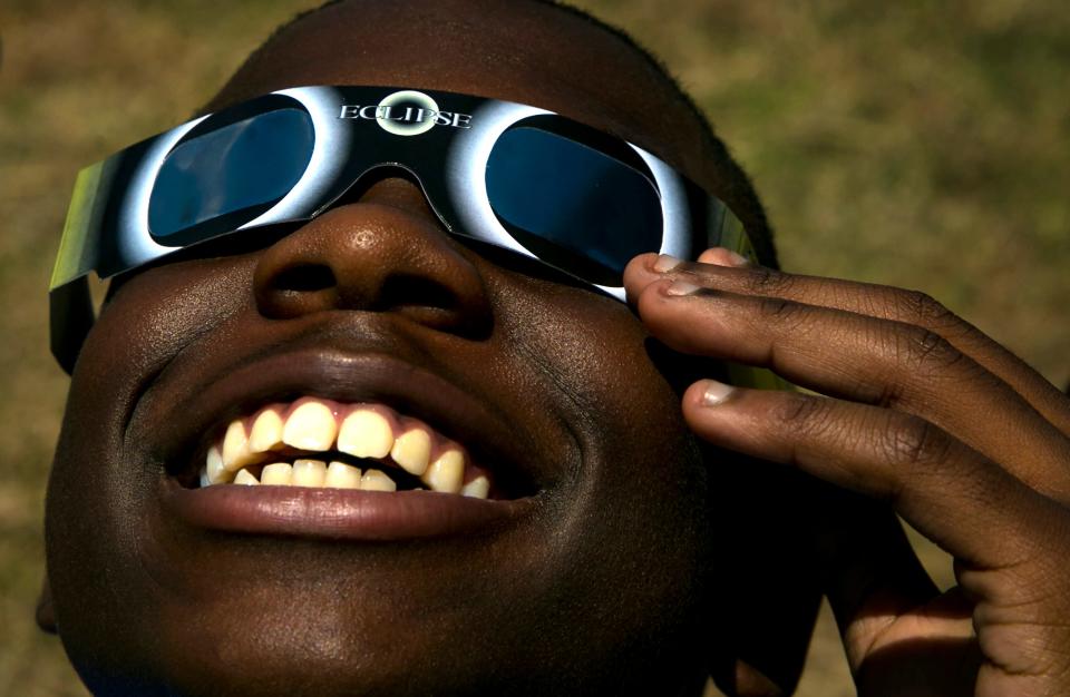 Elijah Weber, 12, looks at the solar eclipse at Burnet Middle School on Monday August 21, 2017. JAY JANNER / AMERICAN-STATESMAN