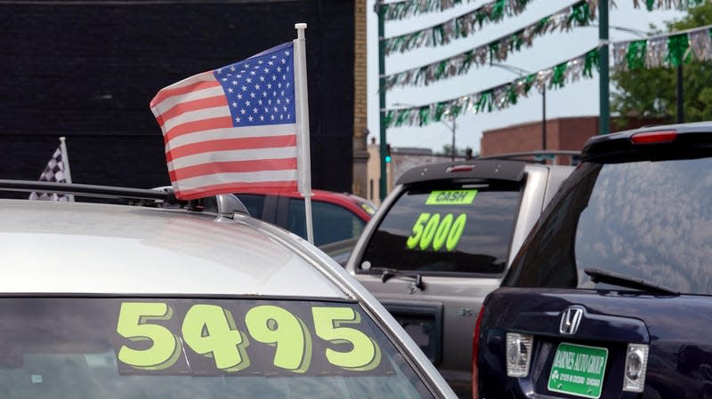 Used cars are offered for sale at a dealership on July 11, 2023 in Chicago, Illinois. 