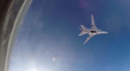 A still image, taken from video footage and released by Russia's Defence Ministry on August 16, 2016, shows a Russian Tupolev Tu-22M3 long-range bomber based in Iran, flying after bombs were dropped off, at an unknown location in Syria. Ministry of Defence of the Russian Federation/Handout via Reuters