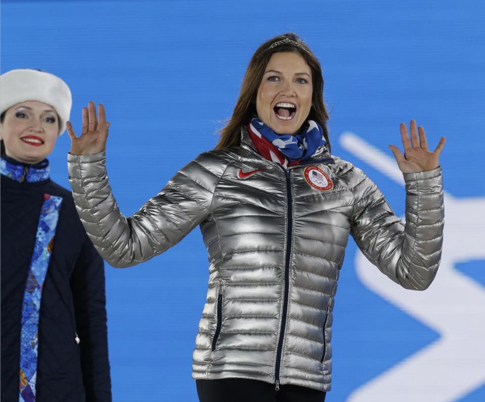 Women's super combined bronze medalist Julia Mancuso of the United States waves during the medals ceremony at the 2014 Winter Olympics, Monday, Feb. 10, 2014, in Sochi, Russia. (AP Photo/Morry Gash)