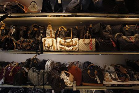 Second-hand luxury handbags are displayed at a Milan Station outlet in Hong Kong September 2, 2013. REUTERS/Bobby Yip